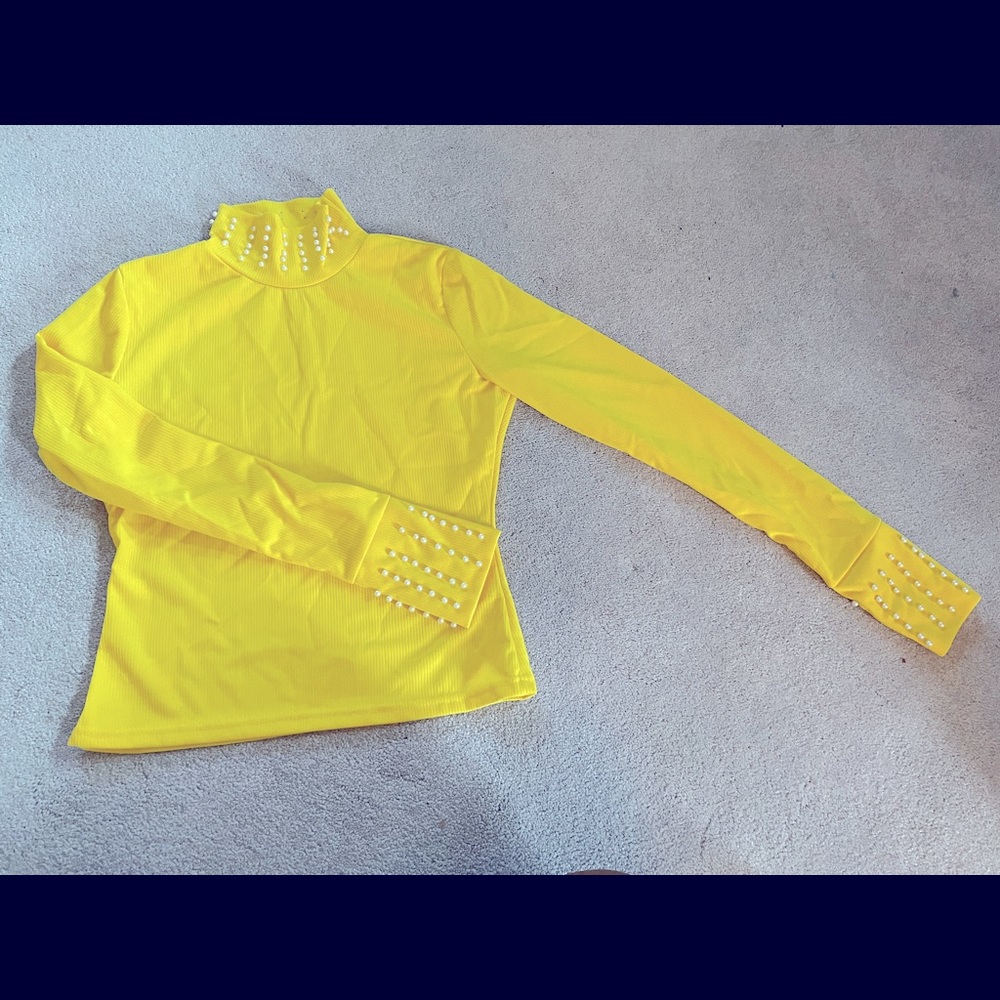 Yellow beaded mock neck top.